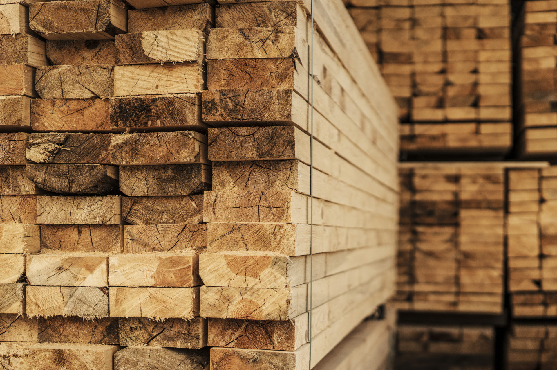 Piles of wood planks in timber yard